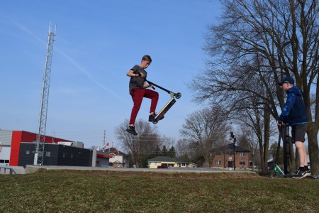 Boy on scooter at skate park