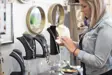 Lady in a store looking at jewelry 